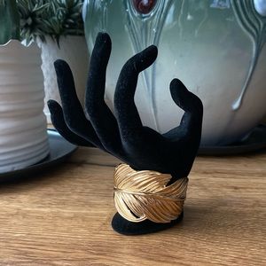 Gold tone Stella & Dot feather cuff bracelet